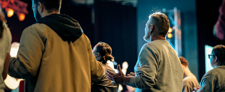 a group of people praying