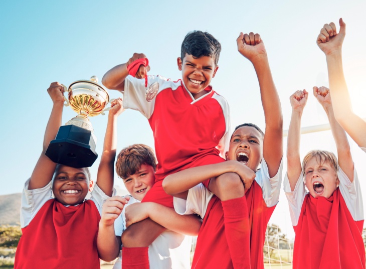 Soccer team holds up trophy