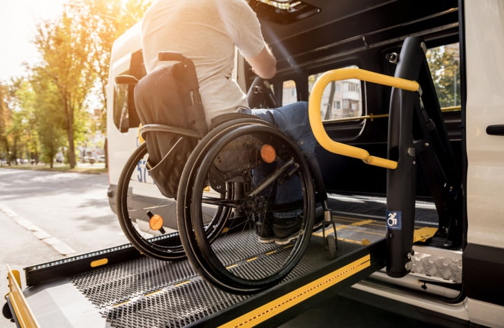 Man in wheelchair on ramp