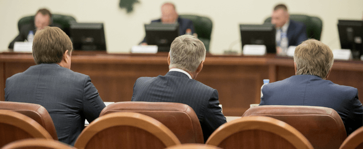 back view of government officials in a meeting