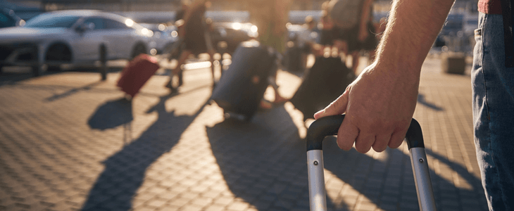 close up view of a hand holding luggage