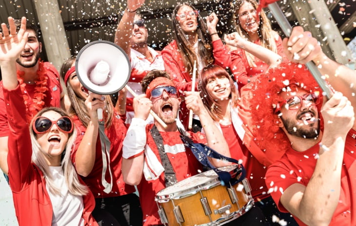 Loud fans celebrate at a sporting event