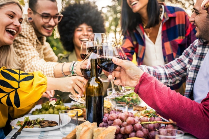 friends laughing with glasses of wine